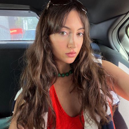 Who What Wear associate beauty editor Alyssa Brascia with long, wavy brown hair