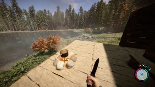 Sons of the Forest cooking pot location - a cooking pot sits over a fire on a wooden balcony overlooking a lake