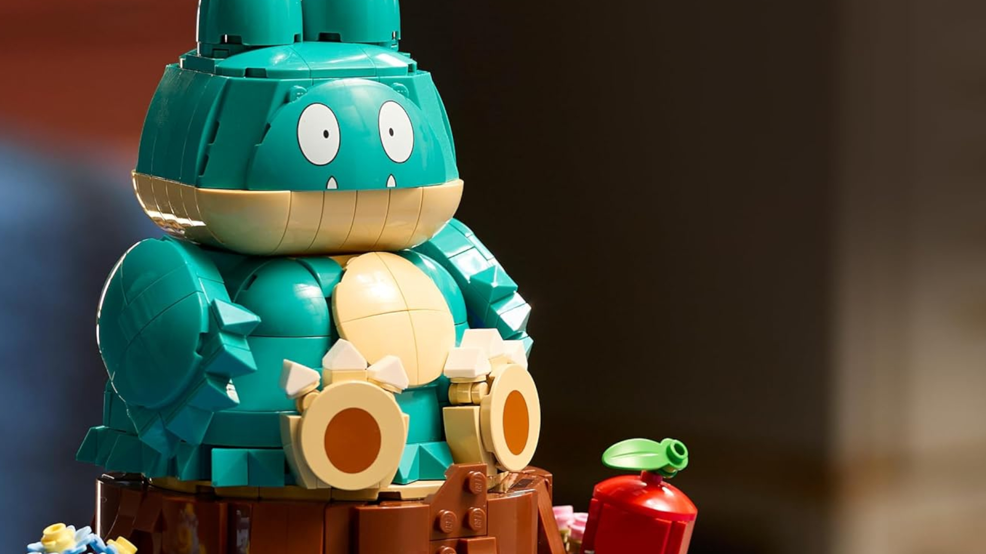 Lego Munchlax sat on a wooden trunk against a blurred background