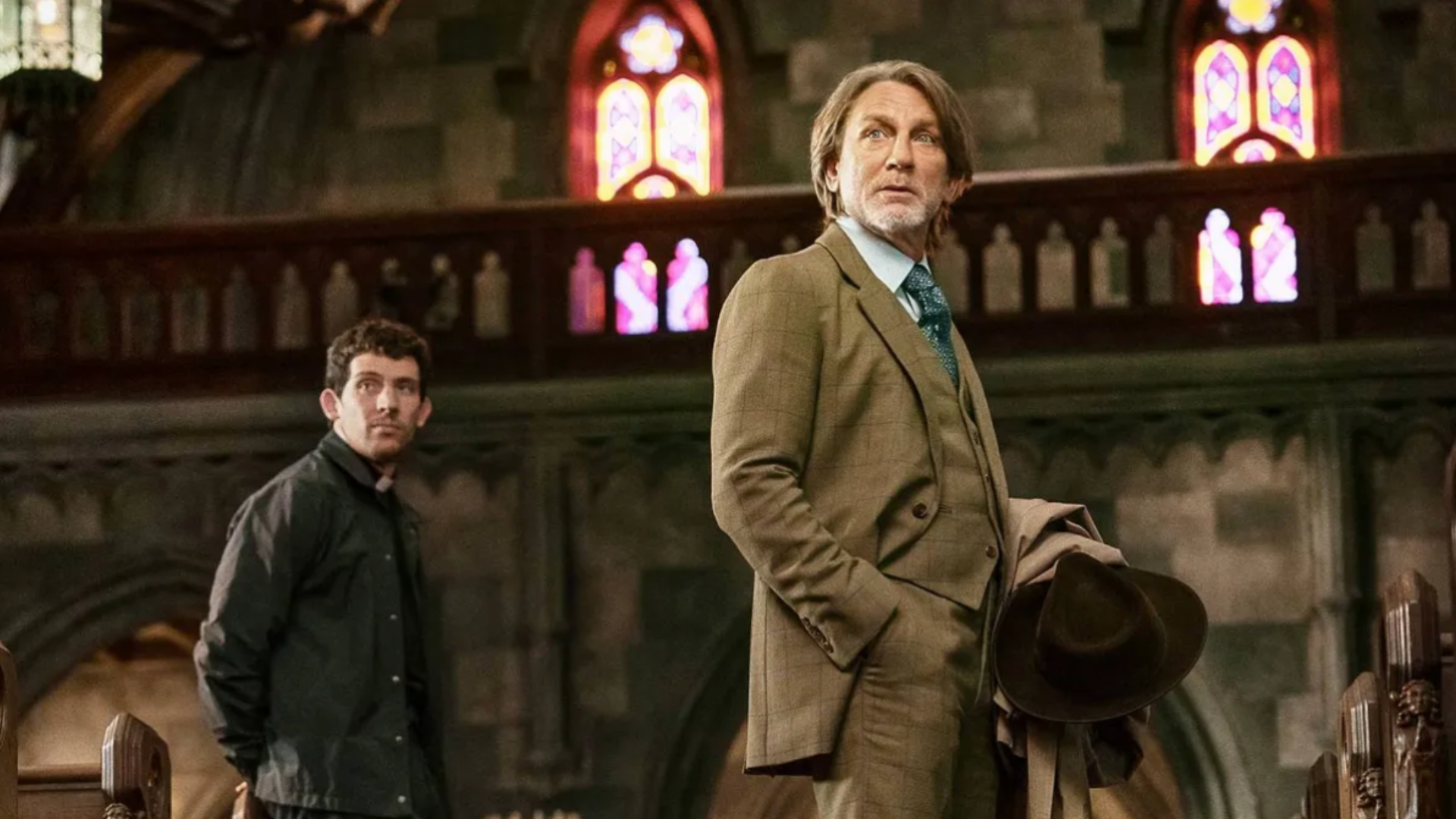 an image of Josh O Conner and Daniel Craig in a Church on the set of Wake Up Dead Man: A Knives Out Mystery. 