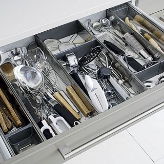 kitchen drawer with kitchen tools and matt bar handle
