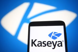 Kaseya logo on a smartphone, set against a blue background