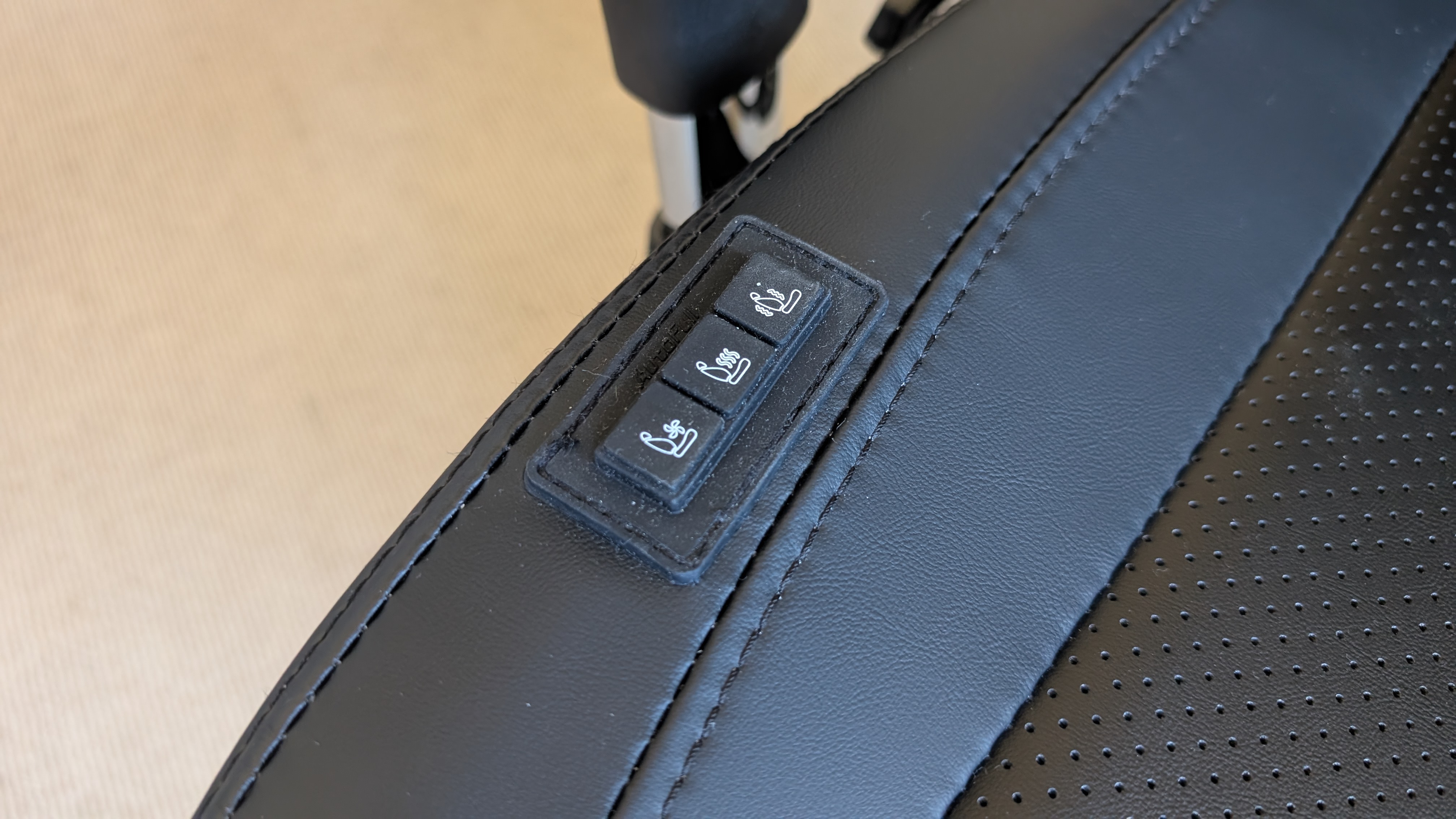 The AutoFull M6 Ultra gaming chair pictured in front of a desk with a gaming PC setup.