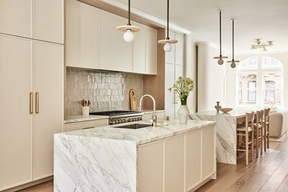 White kitchen cabinets with zellige tiles