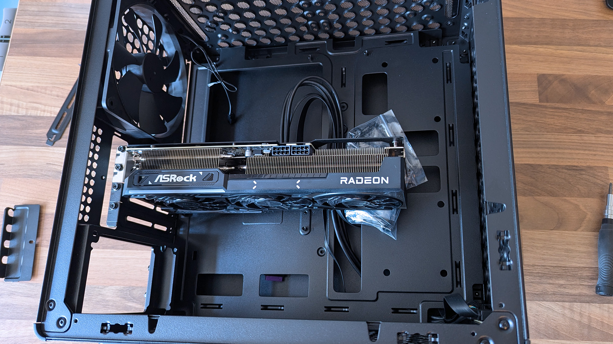 Cooler Master Qube 340 PC case with an ASRock Radeon graphics card inserted without other components