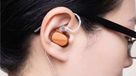 The Saccater Aera in a woman's ear.