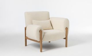 White upholstered chair by Studioilse