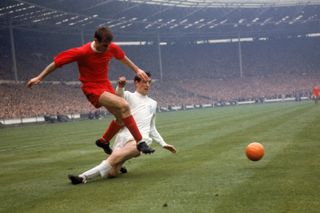 Hunter, right, challenges Roger Hunt for the ball during the 1965 FA Cup final at Wembley