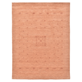 A peach colored geometric wool rug