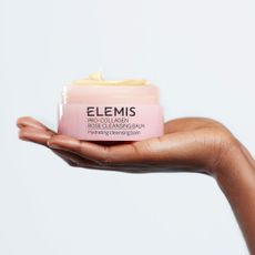 Elemis Pro Collagen Rose Cleansing Balm in the balm of a hand