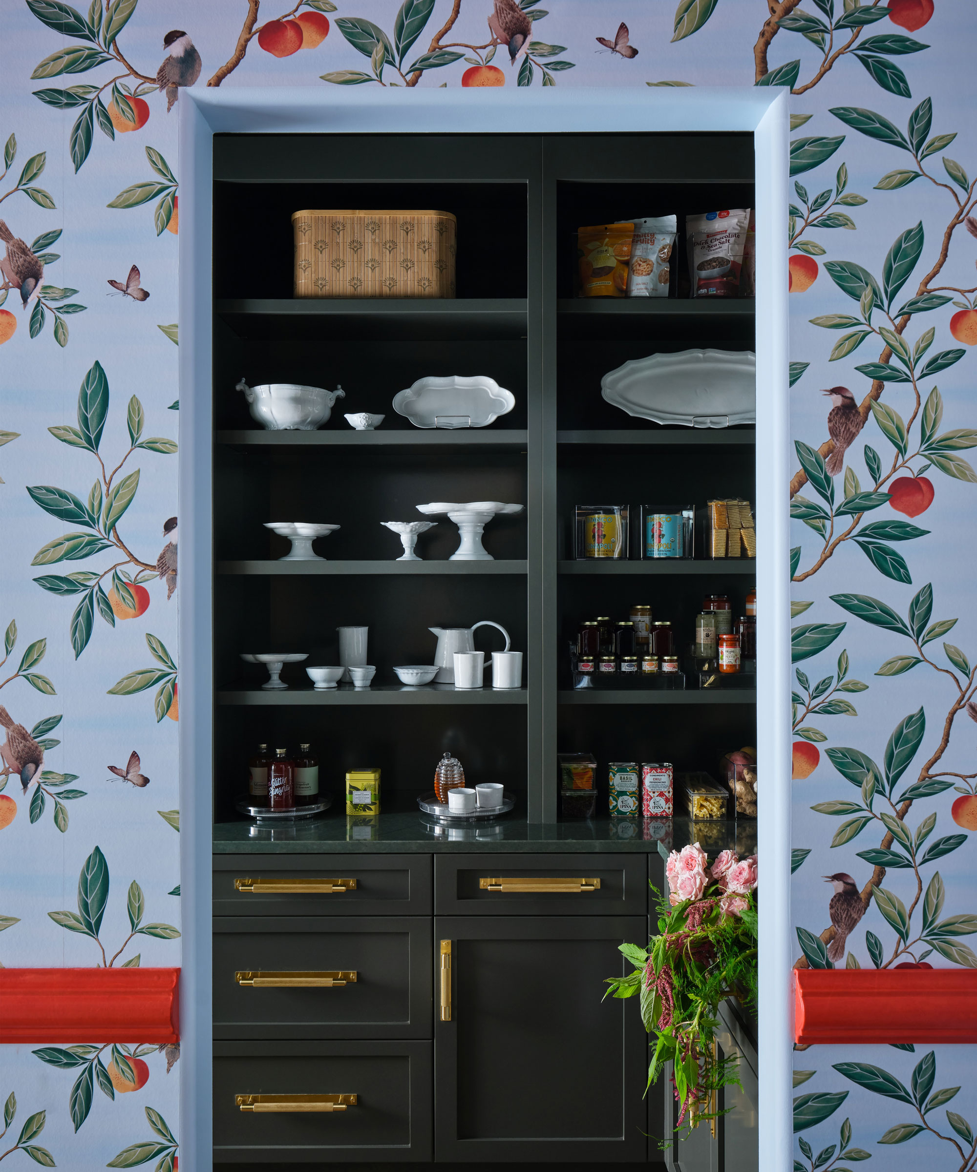 walk-in pantry with blue bird design wallpaper around entrance