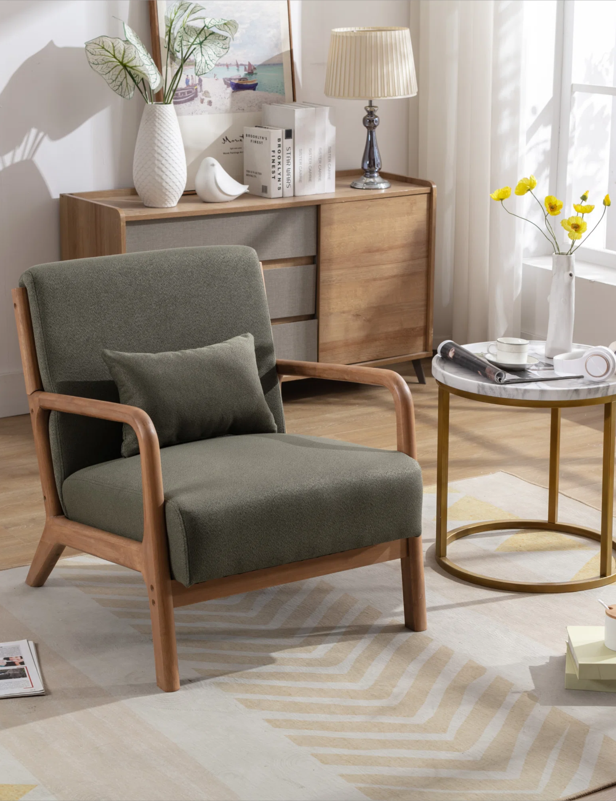 a green accent chair with a wooden frame in a living room with a console table and a marble side table