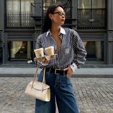 Influencer wears palazzo jeans with a shirt.