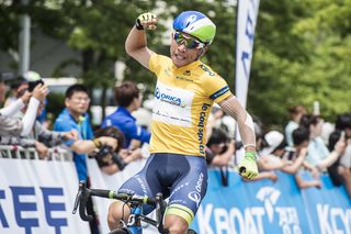 Caleb Ewan pumps the air after winning his fourth stage of the race