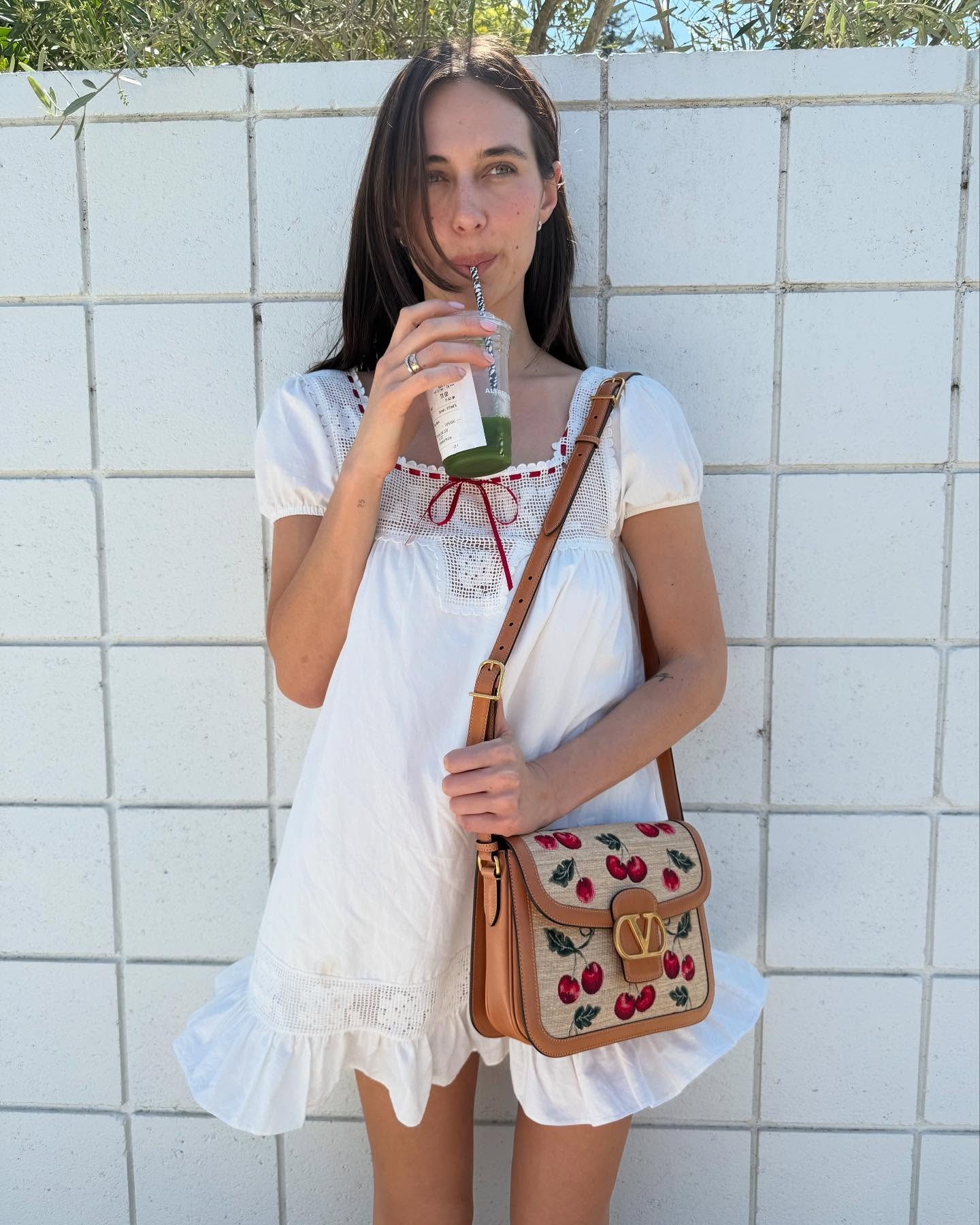 Devon Lee Carlson wears a Frankies Bikinis X Bella Hadid Swing Mini dress in her latest Instagram image.