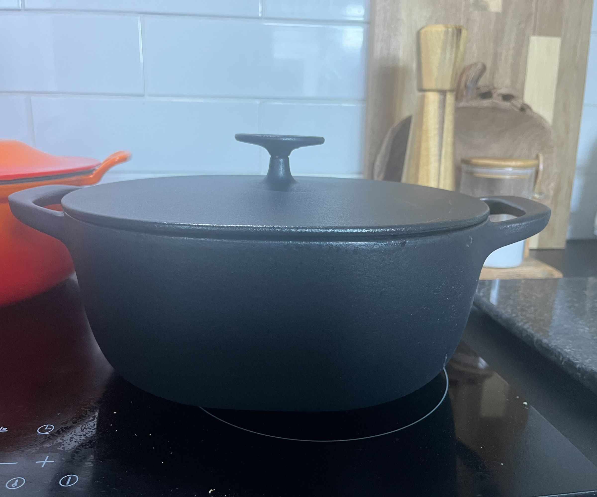 IKEA black Dutch oven on a black electric stove