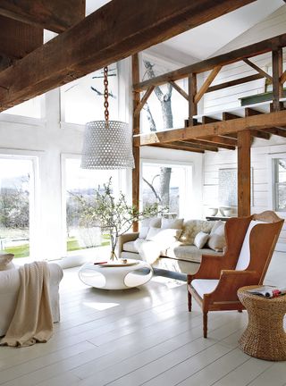 White living room with wood beams and scandi interiors