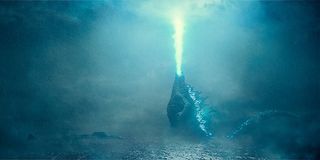Godzilla shooting his atomic breath into the sky