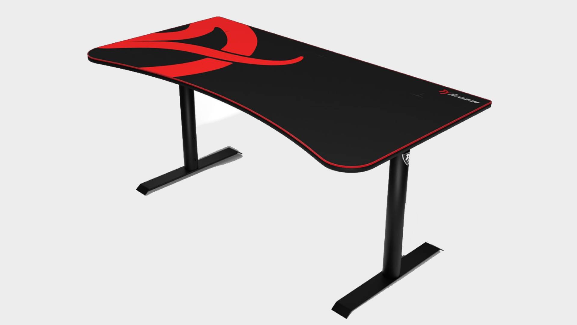 Arozzi gaming desk in red and black at an angle with grey backdrop.