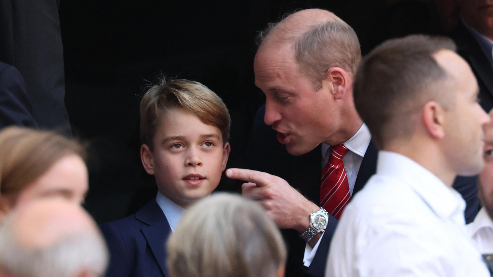Patron of the Welsh Rugby Union Britain's Prince William, Prince of Wales (CR) talks with his son Prince George of Wales (CL) during the France 2023 Rugby World Cup quarter-final match between Wales and Argentina at the Stade Velodrome in Marseille, south-eastern France, on October 14, 2023.