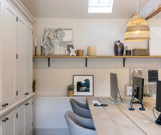 home office with cream cupboards and roof light