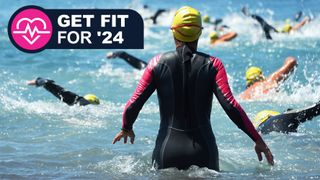 Woman swimming in wetsuit
