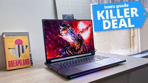 Lenovo Legion Pro 7i gaming laptop on desk with deal tag superimposed