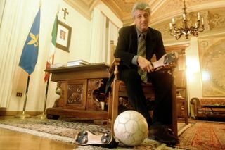 Former footballer Gianni Rivera poses at the Italian Chamber of Deputies in Rome in 1999.