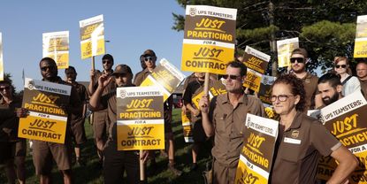 UPS workers and Teamsters members practice picket outside a UPS distribution facility in Madison Heights, Michigan, US, on Tuesday, July 18, 2023. 
