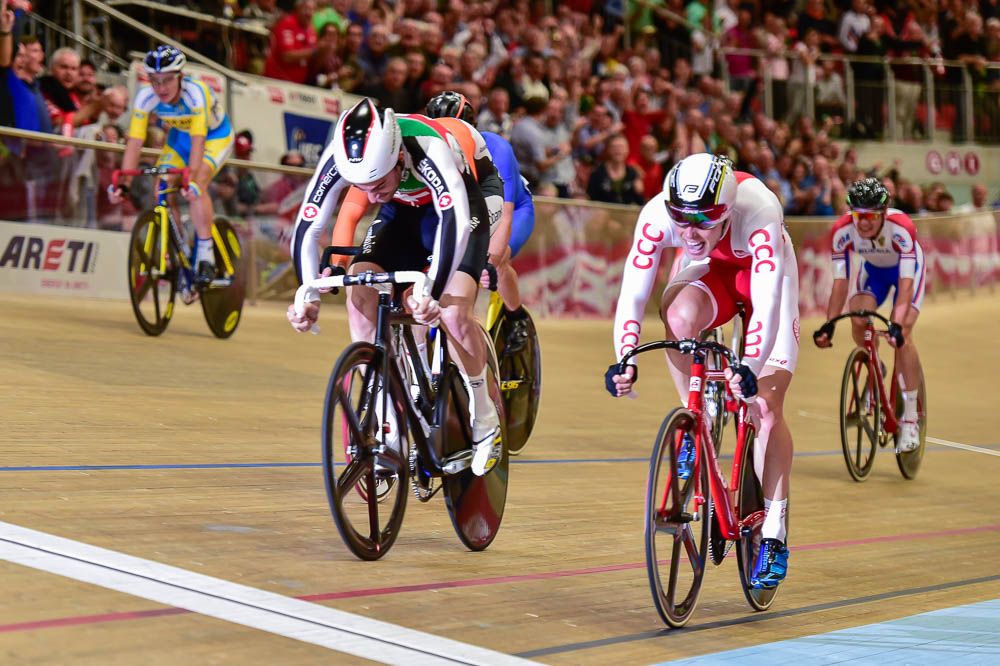 Tristan Marquet of Switzerland wins the final sprint of the scratch race ahead of Poland's Adrian Teklinski