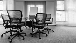 Black office chairs in a meeting room
