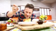 Jamie Oliver cooking and prepping a dish