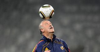 Head coach Vicente del Bosque of Spain heads a ball during a training session, ahead of their 2010 World Cup Stage 2 Round of 16 match against Portugal, at the Green Point Stadium on June 28, 2010 in Cape Town, South Africa.