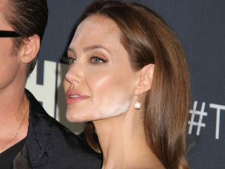 Angelina Jolie powder makeup on her face