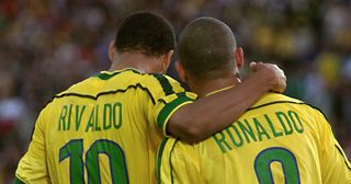 Brazilian Rivaldo embraces forward Ronaldo (R) after he scored the second goal, 16 June at the Stade de la Beaujoire in Nantes, during their 1998 Soccer World Cup group A first round match against Morocco. Brazil won 3-0.