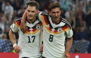 Germany's midfielder #17 Florian Wirtz (L) celebrates scoring the 2-0 goal with his teammate Germany's midfielder #08 Tom Bischof during the UEFA Nations League