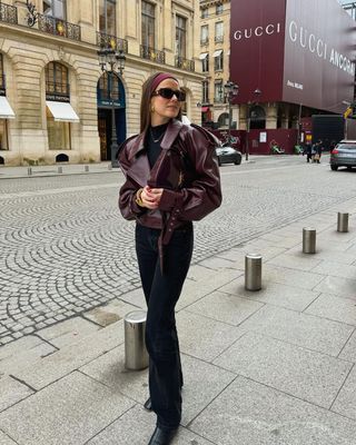 12 Scandi Outfit Ideas: Nina pairs black straight-leg jeans with a statement leather biker jacket.
