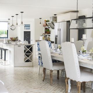 White dining room and kitchen with neutral décor