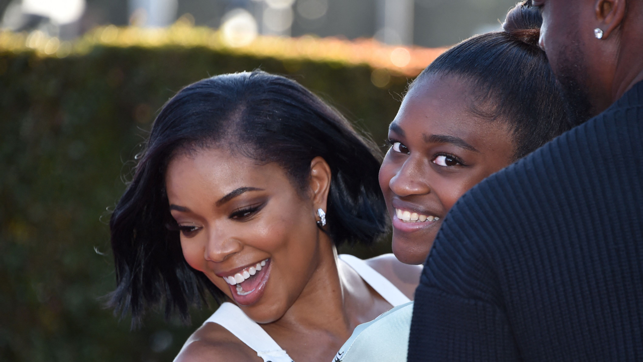 US actress Gabrielle Union and her daughter Zaya Wade arrive for the &quot;Cheaper by the Dozen&quot; Disney premiere at the El Capitan theatre in Hollywood, California, March 16, 2022.