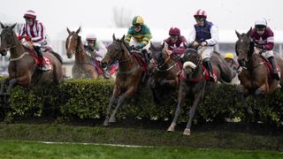 Davy Russell riding Tiger Roll (C, purple cap) during The Glenfarclas Chase on day two of The Festival at Cheltenham Racecourse