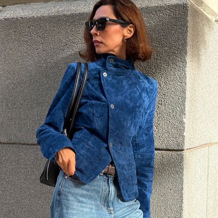 Woman in a blue suede Zara jacket and jeans