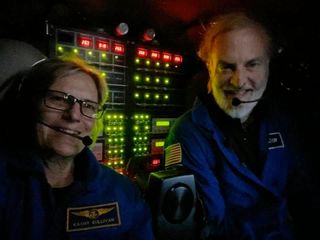 Former astronaut Kathy Sullivan and explorer Victor Vescovo are seen aboard the "Limiting Factor" deep sea submersible at the bottom of Challenger Deep, Sunday, June 7, 2020.