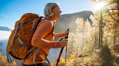 Woman hiking up a hill