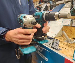 A side by side comparison of an impact drive and a combi drill with drill bits