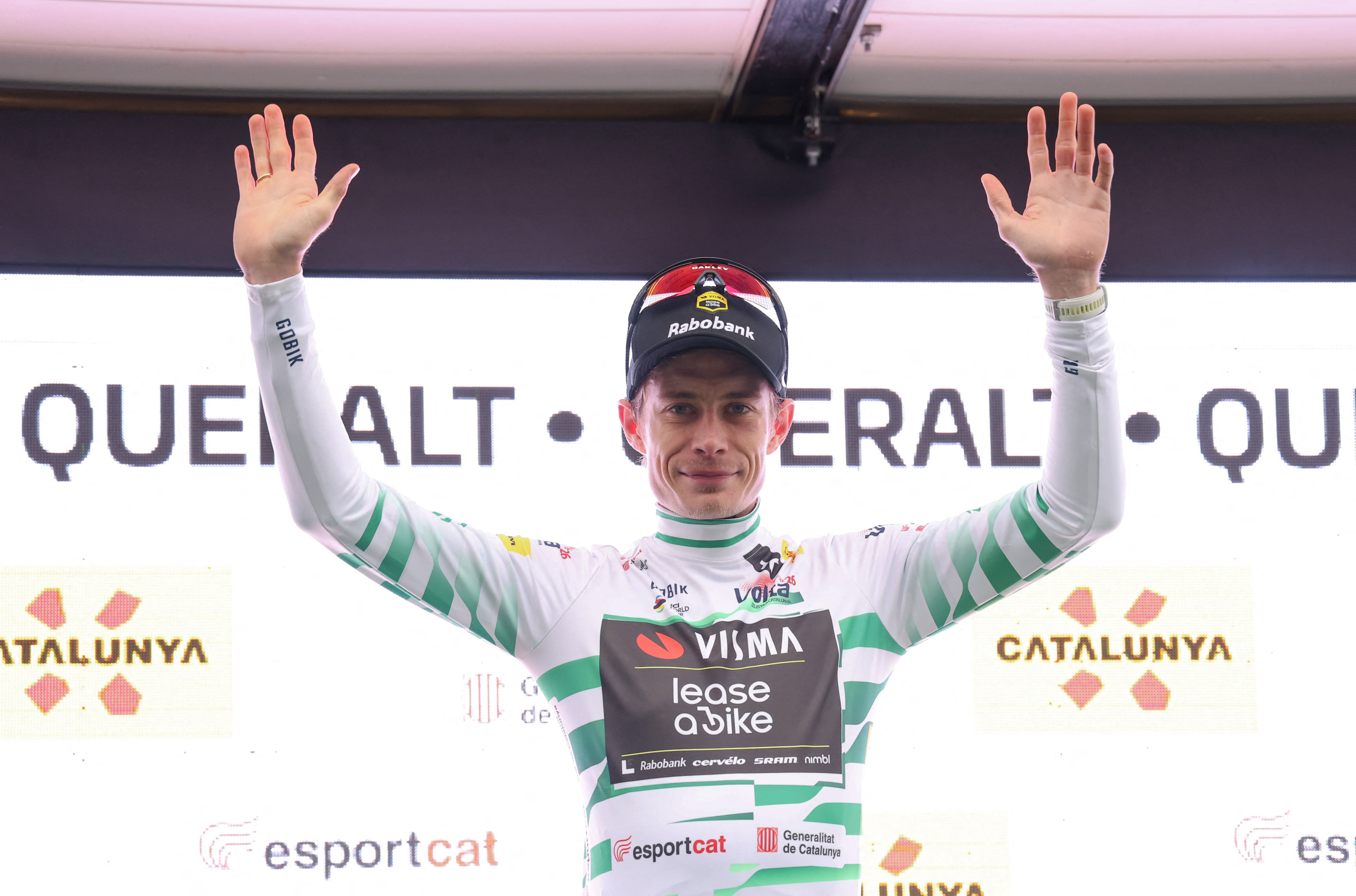 Team Visma-Lease a bike's Danish rider Jonas Vingegaard celebrates on the podium after winning the sixth stage of the 2026 'Volta a Catalunya' cycling tour of Catalonia, a 158 km race between Berga and the Sanctuary of La Mare de Deu de Queralt in Berga, on March 28, 2026. (Photo by Josep LAGO / AFP)