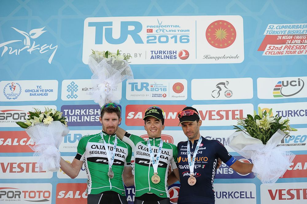 Jose Goncalves of Caja Rural-Seguros RGA, Bilbao Lopez de Armentia Pello of Caja Rural-Seguros RGA, and Mauro Finetto of Unieuro Wilier celebrate on the stage 2 podium at Tour of Turkey