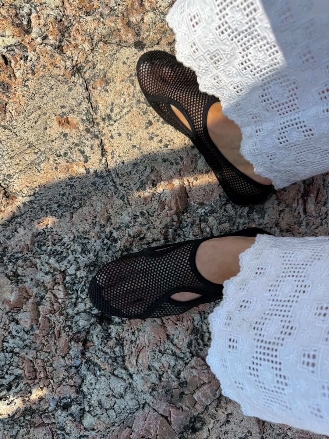 Elsa Hosk wearing Alaia fishnet water shoes