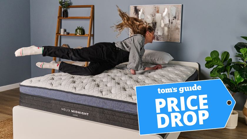 Mattress tester Nicola Appleton dives onto the Helix Midnight Luxe mattress in our Sleep Lab. In the bottom right corner, a Tom's Guide Price Drop deals graphic