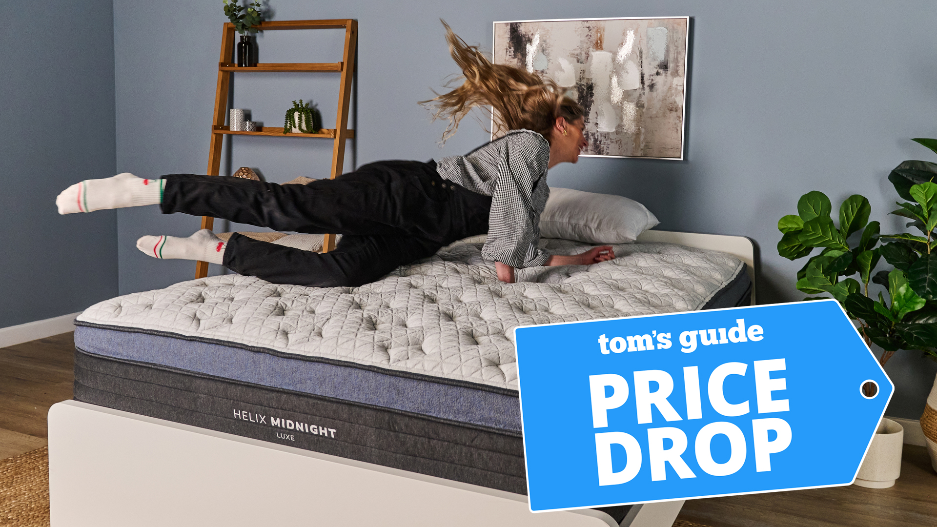 Mattress tester Nicola Appleton dives onto the Helix Midnight Luxe mattress in our Sleep Lab. In the bottom right corner, a Tom's Guide Price Drop deals graphic