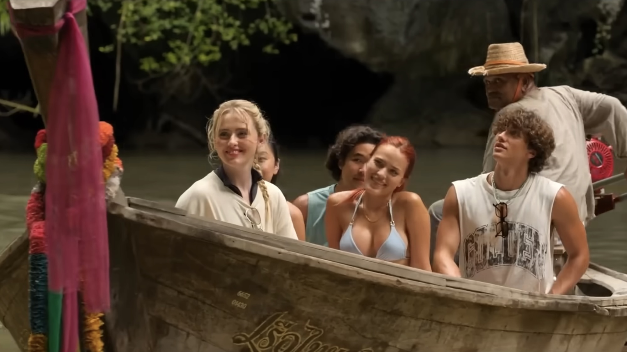 Sara, Max and others in boat traveling to Devil's Mouth cave in The Devil's Mouth